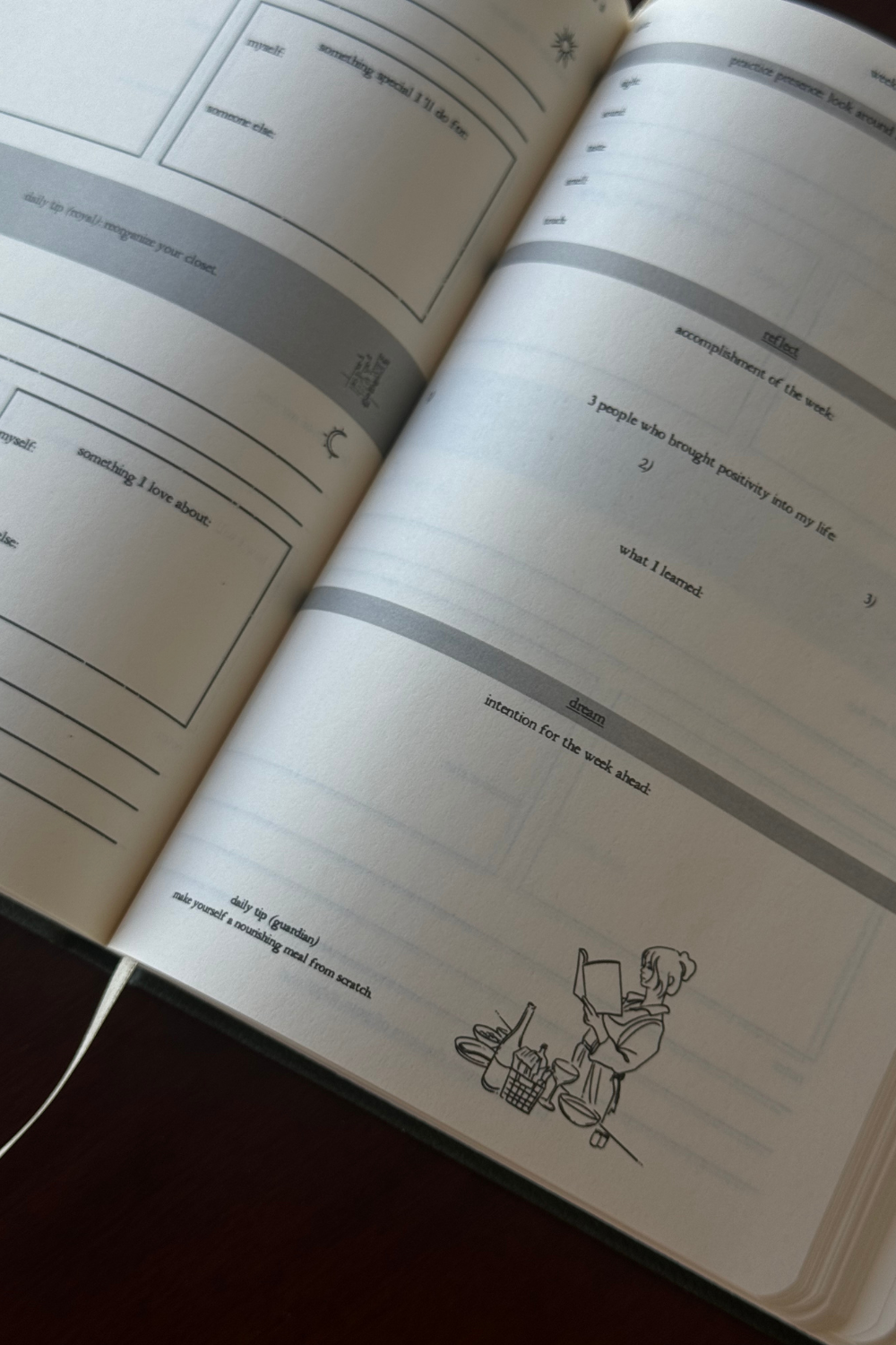 User enjoying writing in the Romanticize Your Life Journal outdoors.