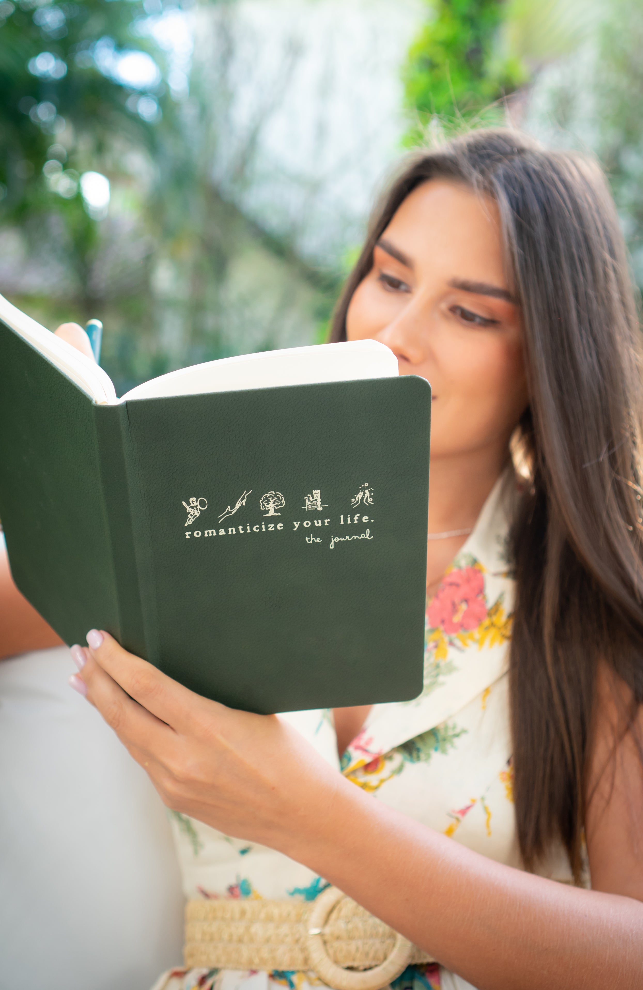 Open Romanticize Your Life Journal with pages filled with handwritten reflections.